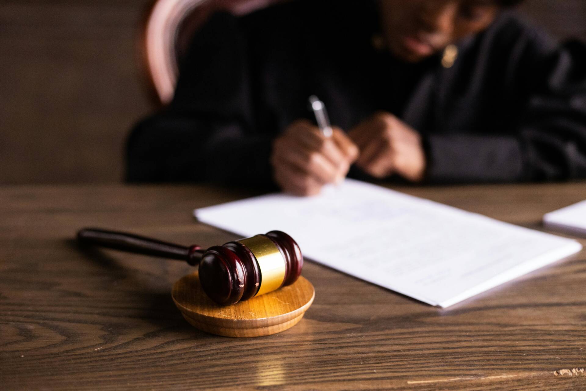 Judge writing on a piece of paper