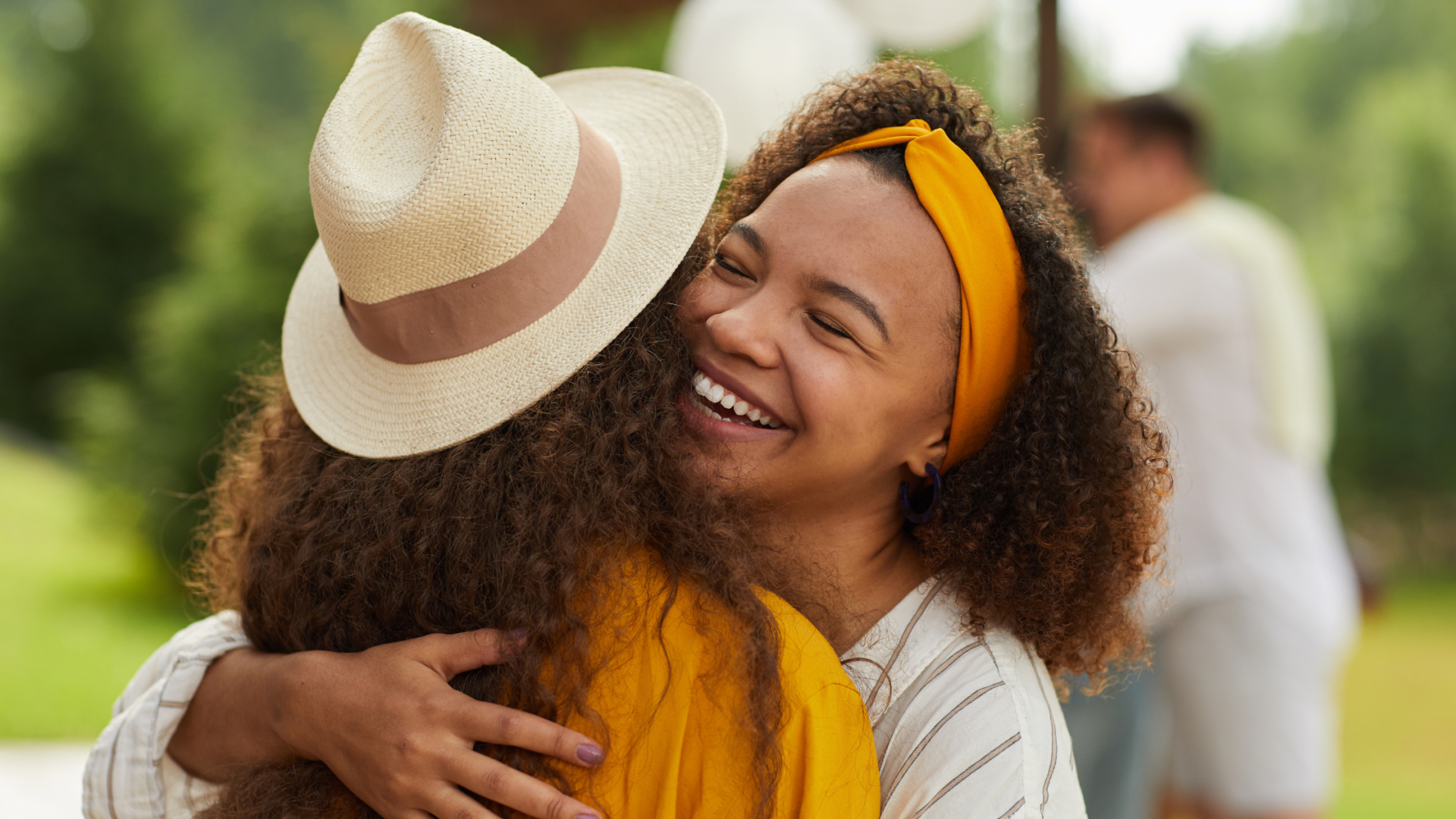 two women happy and hugging