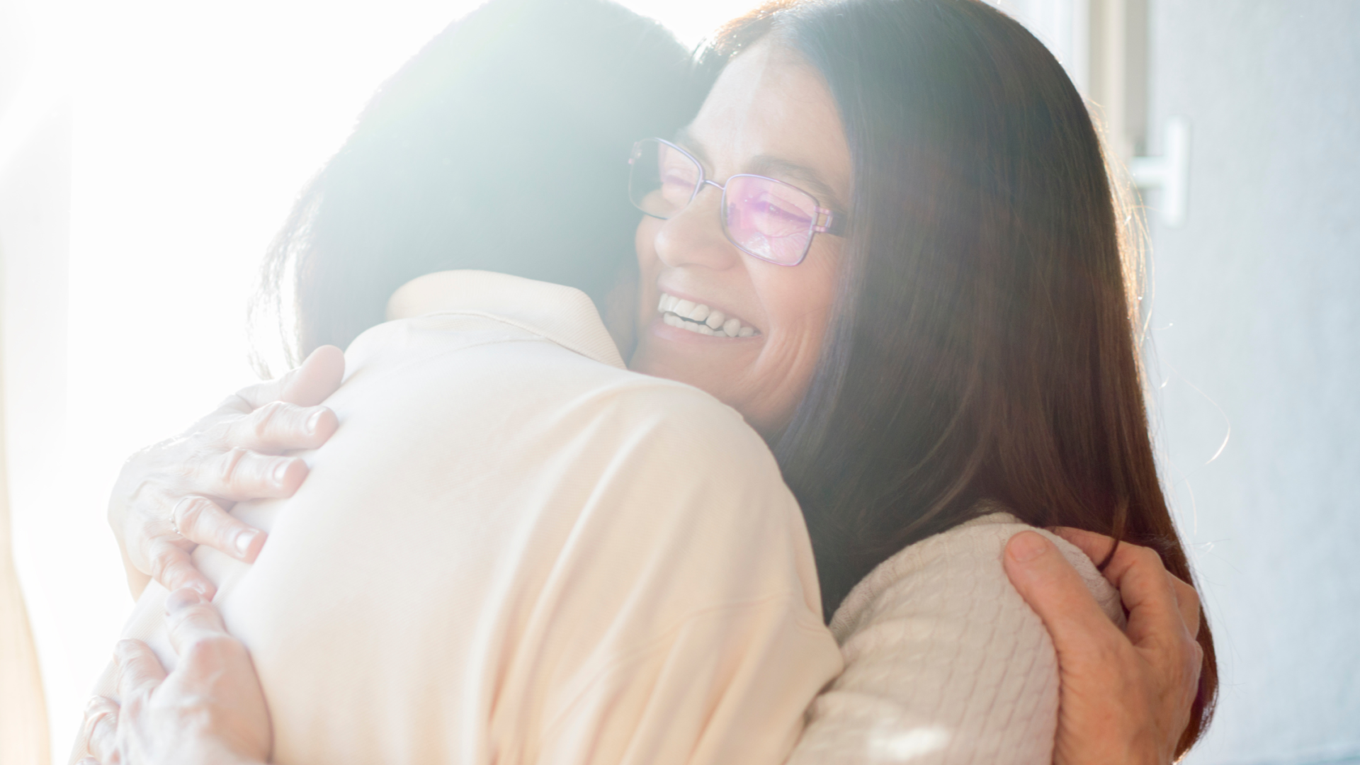 a happy scene of two woman hugging